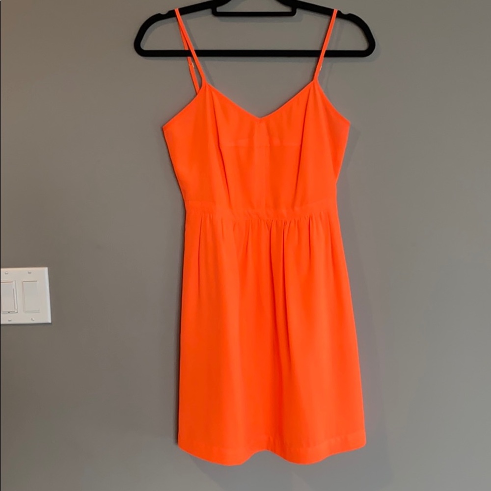 Show stopping neon orange mini dress